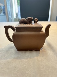 A Chinese Yixing stoneware 'lion and brocade ball' teapot and cover, 19/20th C.