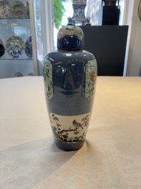 A Chinese famille verte powder-blue-ground 'Fish and Bird' vase and cover, 19th C.