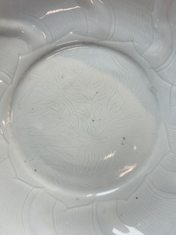 A Chinese moulded white-glazed plate with anhua floral design and a copper-mounted rim, Xuande mark, late Ming