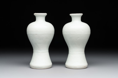 A pair of Chinese incised white-glazed 'Meiping' vases, Wanli mark and of the period, and a pair of blue and white covered jarlets, Ming
