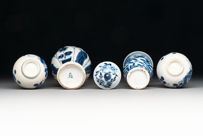 Four Chinese blue and white miniature vases, one with cover, Kangxi