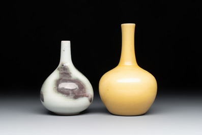 A Chinese copper-red and white 'Mythical Beasts' vase and a yellow-glazed bottle vase, on later wooden stands, Kangxi and later