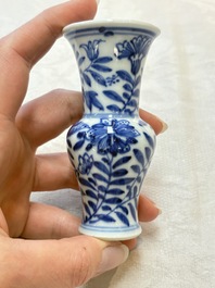 Four Chinese blue and white miniature vases, one with cover, Kangxi