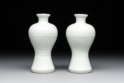 A pair of Chinese incised white-glazed 'Meiping' vases, Wanli mark and of the period, and a pair of blue and white covered jarlets, Ming
