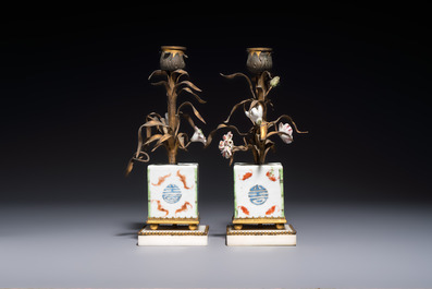 A pair of gilt silver and metal candlesticks with Chinese porcelain, European porcelain flowers, and marble bases, marked Boin-Taburet, late 19th C.