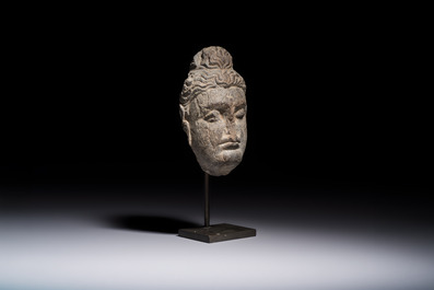 A Gandhara grey schist relief fragment of a Bodhisattva head, 3rd/4th C.