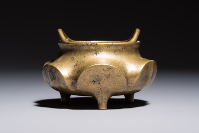 A Chinese bronze flower-shaped tripod censer with handles, Xuande mark, 19th C.
