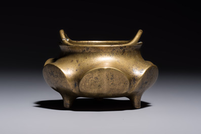 A Chinese bronze flower-shaped tripod censer with handles, Xuande mark, 19th C.