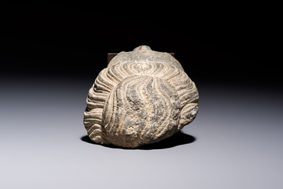 A Gandhara grey schist relief fragment of a Bodhisattva head, 3rd/4th C.