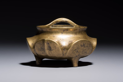 A Chinese bronze flower-shaped tripod censer with handles, Xuande mark, 19th C.