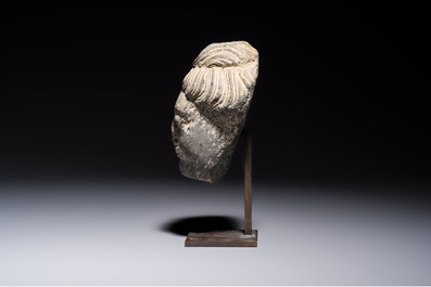 A Gandhara grey schist relief fragment of a Bodhisattva head, 3rd/4th C.