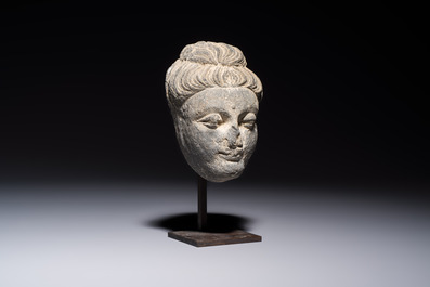 A Gandhara grey schist relief fragment of a Bodhisattva head, 3rd/4th C.