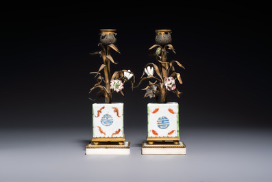 A pair of gilt silver and metal candlesticks with Chinese porcelain, European porcelain flowers, and marble bases, marked Boin-Taburet, late 19th C.