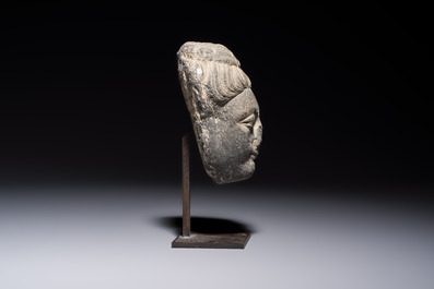 A Gandhara grey schist relief fragment of a Bodhisattva head, 3rd/4th C.
