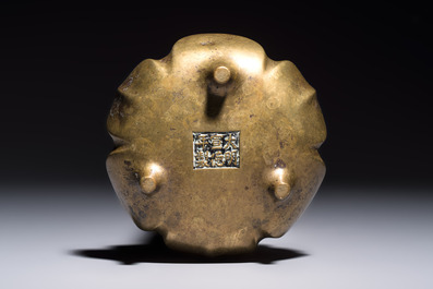 A Chinese bronze flower-shaped tripod censer with handles, Xuande mark, 19th C.