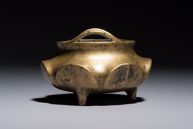 A Chinese bronze flower-shaped tripod censer with handles, Xuande mark, 19th C.