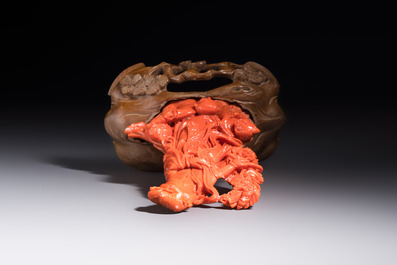 A Chinese carved red coral 'Goddess and Boys' group on a wooden stand, 19/20th C.