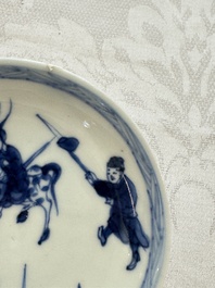 23 Chinese blue and white saucers with figural design, Yongzheng/Kangxi