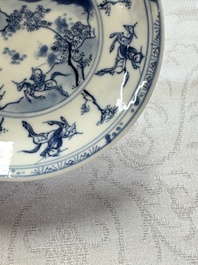 23 Chinese blue and white saucers with figural design, Yongzheng/Kangxi