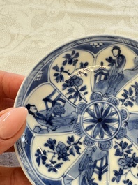 23 Chinese blue and white saucers with figural design, Yongzheng/Kangxi