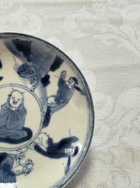 23 Chinese blue and white saucers with figural design, Yongzheng/Kangxi