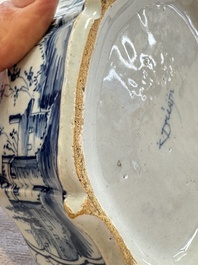 A blue and white Dutch Delft butter tub with a polychrome bird-shaped finial, 18th C.