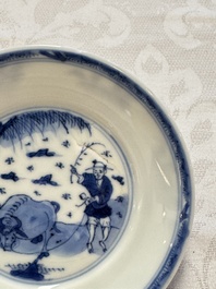23 Chinese blue and white saucers with figural design, Yongzheng/Kangxi