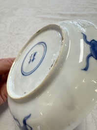 23 Chinese blue and white saucers with figural design, Yongzheng/Kangxi