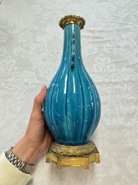 A pair of gilt-bronze-mounted Chinese turquoise-glazed vases, 19th C.