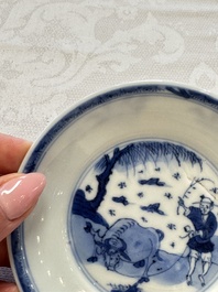23 Chinese blue and white saucers with figural design, Yongzheng/Kangxi