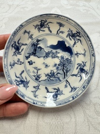 23 Chinese blue and white saucers with figural design, Yongzheng/Kangxi