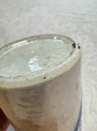 A Chinese Nanking water pot, a blue and white brush pot, a jarlet and a trick cup, Ming and later