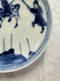 23 Chinese blue and white saucers with figural design, Yongzheng/Kangxi