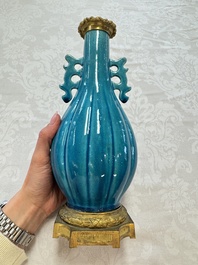 A pair of gilt-bronze-mounted Chinese turquoise-glazed vases, 19th C.