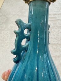 A pair of gilt-bronze-mounted Chinese turquoise-glazed vases, 19th C.