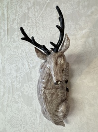 A pair of Chinese aubergine-glazed models of recumbent deer, 18/19th C.