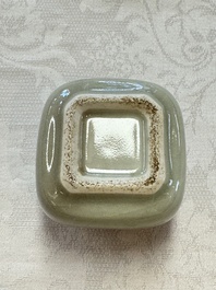 A Chinese Nanking water pot, a blue and white brush pot, a jarlet and a trick cup, Ming and later