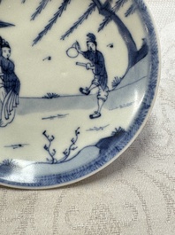 23 Chinese blue and white saucers with figural design, Yongzheng/Kangxi