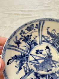 23 Chinese blue and white saucers with figural design, Yongzheng/Kangxi