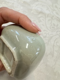 A Chinese Nanking water pot, a blue and white brush pot, a jarlet and a trick cup, Ming and later