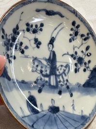 23 Chinese blue and white saucers with figural design, Yongzheng/Kangxi