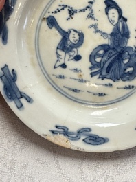 23 Chinese blue and white saucers with figural design, Yongzheng/Kangxi