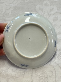 23 Chinese blue and white saucers with figural design, Yongzheng/Kangxi