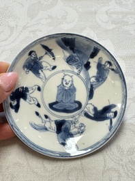 23 Chinese blue and white saucers with figural design, Yongzheng/Kangxi