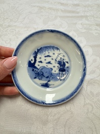 23 Chinese blue and white saucers with figural design, Yongzheng/Kangxi