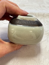 A Chinese Nanking water pot, a blue and white brush pot, a jarlet and a trick cup, Ming and later