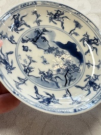 23 Chinese blue and white saucers with figural design, Yongzheng/Kangxi