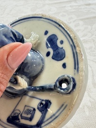A rare Japanese blue and white 'Pipe Smoker' incense burner and cover, Edo, 17th C.