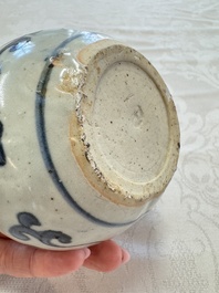 A Chinese Nanking water pot, a blue and white brush pot, a jarlet and a trick cup, Ming and later