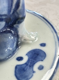 A rare Japanese blue and white 'Pipe Smoker' incense burner and cover, Edo, 17th C.